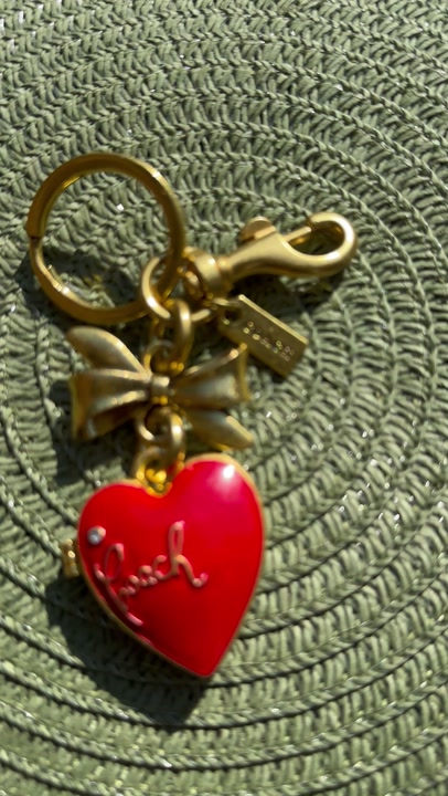 Coach red charm